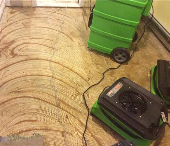 Air movers setup in a room to dry the floor in Montclair, NJ
